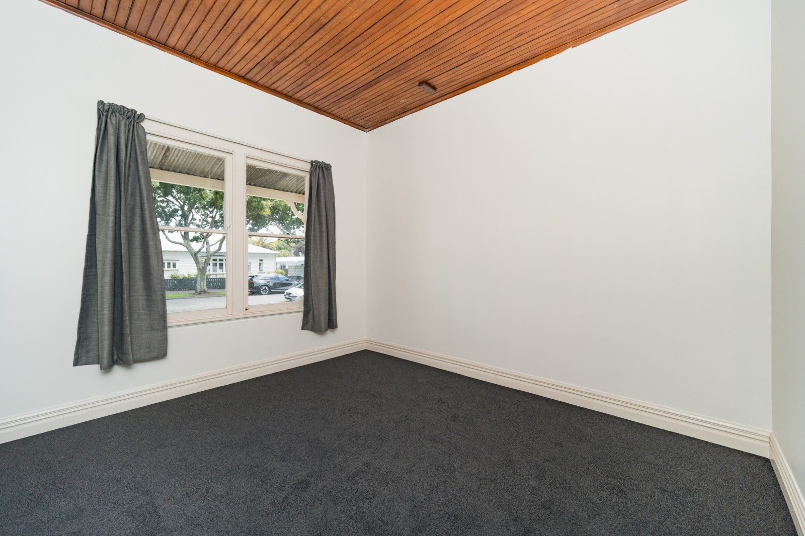 Palmerston North bedroom with timber ceiling